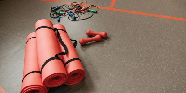 Yoga equipment on a dark stylish floor